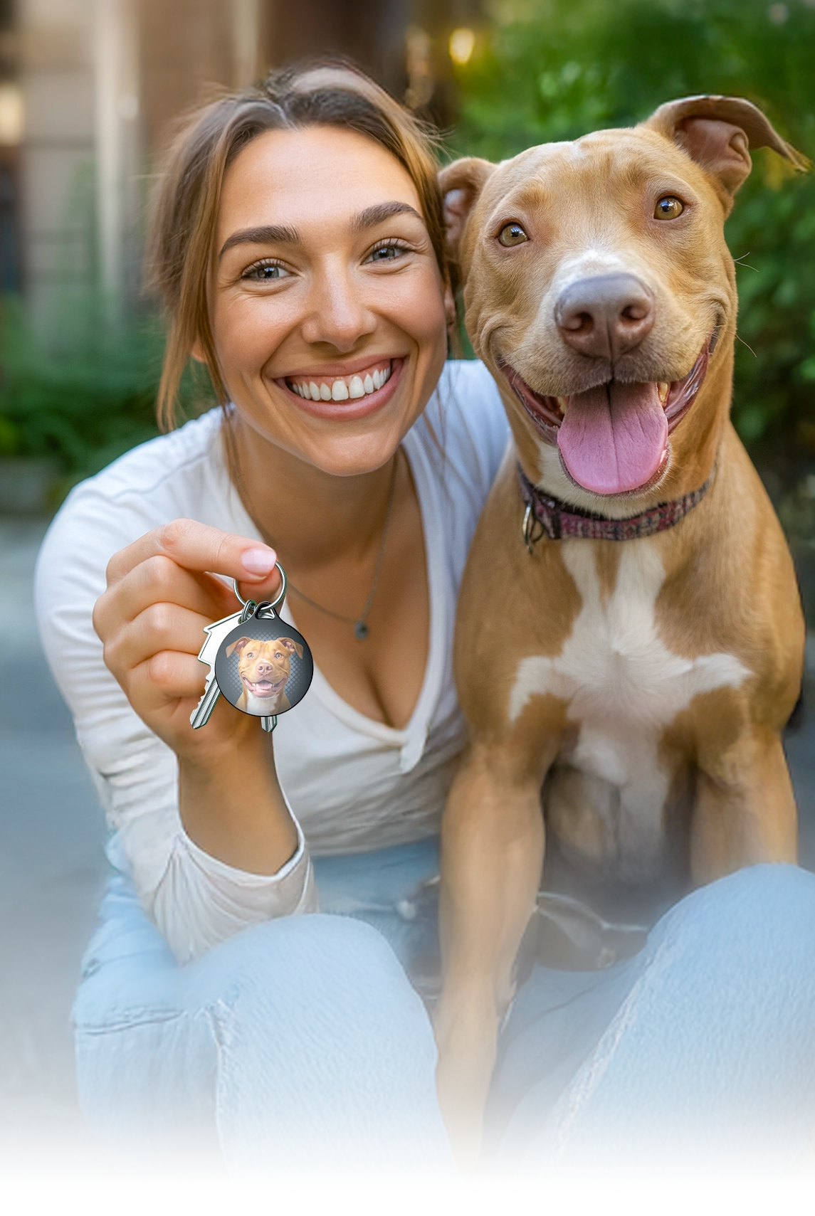 woman-holding-a-phido-keyfob-with-a-pitbull-dog-m